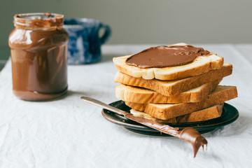 Slices of bread with chocolate cream. Close up.