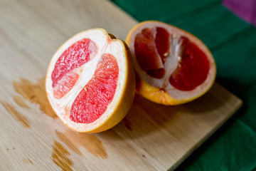 Grapefruit on wooden cutting Board