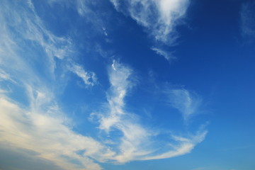 Naklejka na ściany i meble Blue sky with fluffy clouds background
