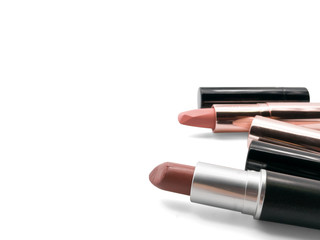 Obraz premium Nude lipstick, selective focus, isolated on white background with copy space
