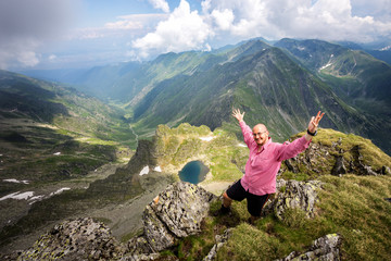 Naklejka premium Hiker on top of the Lespez mountainpeak in the Carpathians.