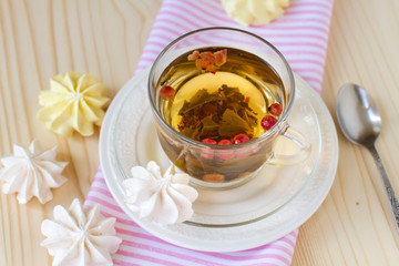 Marshmallow and cup of tea on  table.