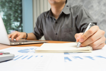 businessman working with documents and laptop in home office, Bu