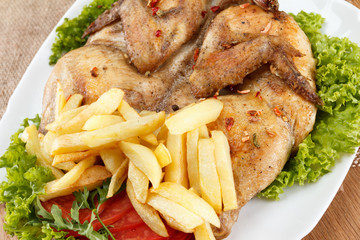 Chicken fried with potato and vegetables