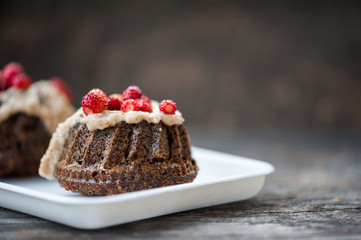 Mini chocolate bundt cake with cheese cream and strawberries