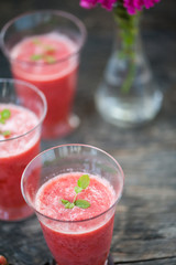 Watermelon juice on a wooden table