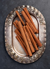 Cinnamon sticks on vintage plate