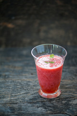 Watermelon juice on a wooden table