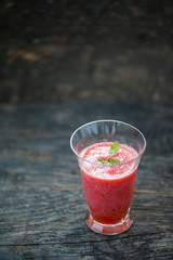 Watermelon juice on a wooden table