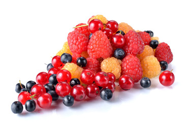 Red and yellow raspberries, currants and blueberries are isolate
