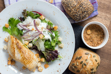 Homemade Chicken Caesar Salad with Cheese and Croutons, top view.