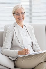 Portrait of smiling therapist in office