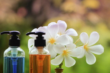 Fototapeta na wymiar Body care product,shower,shampoo,lotion and Frangipani or plumer