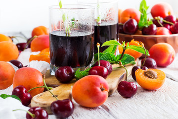 Ceramic bowl with organic ripe apricots and cherries