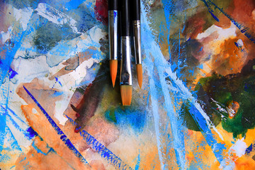 Closeup of brushes and palette.
