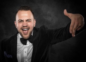 Young business man pointing at the camera.