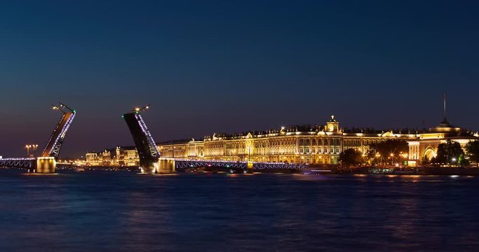 Russia, Saint-Petersburg, 02 July 2016: Time-lapse of a opening Palace Bridge, a lot of Observing tourists, Neva River at sunrise, Winter Palace, the Hermitage, the Admiralty, a lot ships and boats