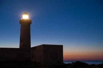 Poster The lighthouse of Syracuse before the dawn against a starry sky
