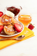 Cheese pancakes with fruit and sweets