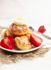 Cheese pancakes with fruit and sweets