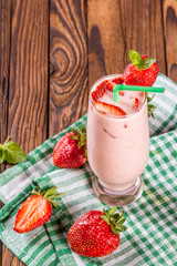 glass of smoothie, yogurt and fresh strawberries