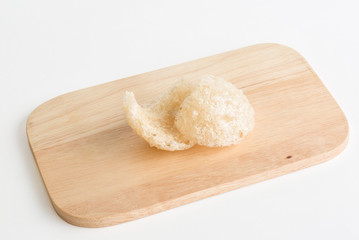 Swift Bird's nest on wooden plate on white background