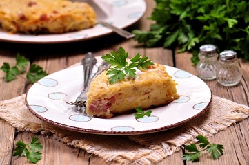 potato casserole with bacon, onion and cheese, baked in Multi cooker, crock-pot.