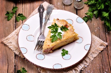 potato casserole with bacon, onion and cheese, baked in Multi cooker, crock-pot.