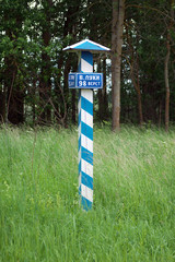 The old milepost in the indication of the distance to the Great Luke - obrazy, fototapety, plakaty