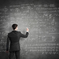 Man writing on blackboard