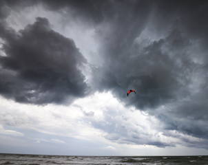 Power kite in sea and storm sky