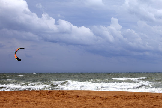 Power kite in sea and cloudy sky