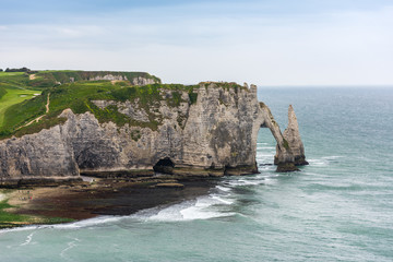 Fototapeta premium The beach and stone cliffs in Etretat, France