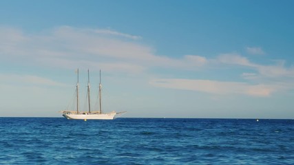 Sailing ship with three masts in the sea - Powered by Adobe