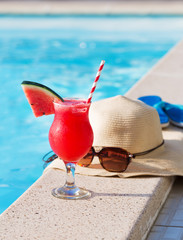 Watermelon fresh juice smoothie drink cocktail slippers, hat, sunglasses pool