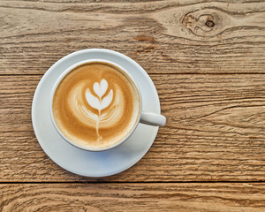 tree art cappuccino coffee on grunge wooden table