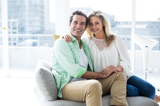 Happy Couple Resting On Sofa 