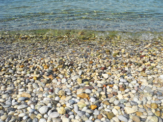 Background of pebbles and sea.