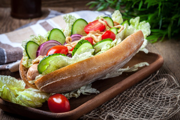 Homemade sandwich on a wooden table.