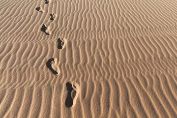 Zelfklevend Fotobehang Footprints on a sand dunes desert © AnnaMoskvina