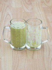 Full and empty glass of smoothie