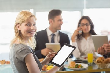 Business people having meal in restaurant