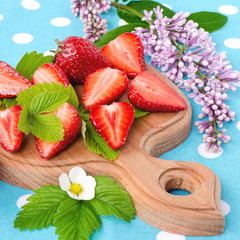 Ripe sliced strawberries. The strawberry season.