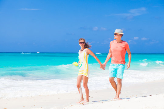 beautiful happy couple having fun at sunny beach