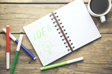 notebook,markers and coffee