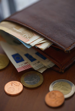 Brown Wallet With Euro Money Inside And Coins, Credit Cards Near