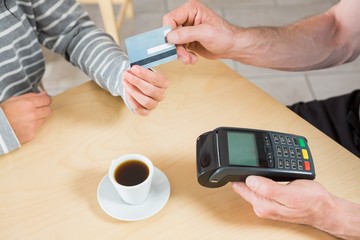 Woman making payment through credit card