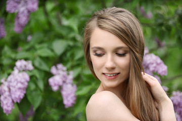 Fototapeta premium Young beautiful bride in the garden