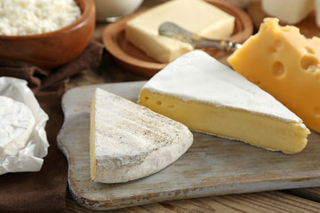 Cheese on wooden cutting board