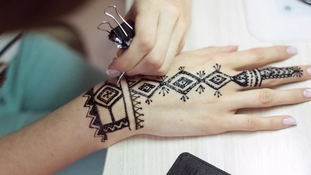 Henna tattoo on women hands